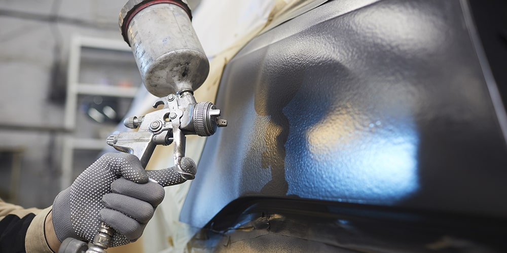 Qual pressão devo usar na minha pistola para pintar um carro